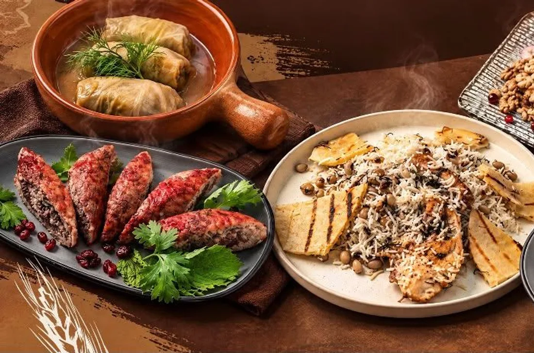 An Azerbaijani table: dolma, kufta, saffron plov, roasted Levengi chicken, salads and pomegranate